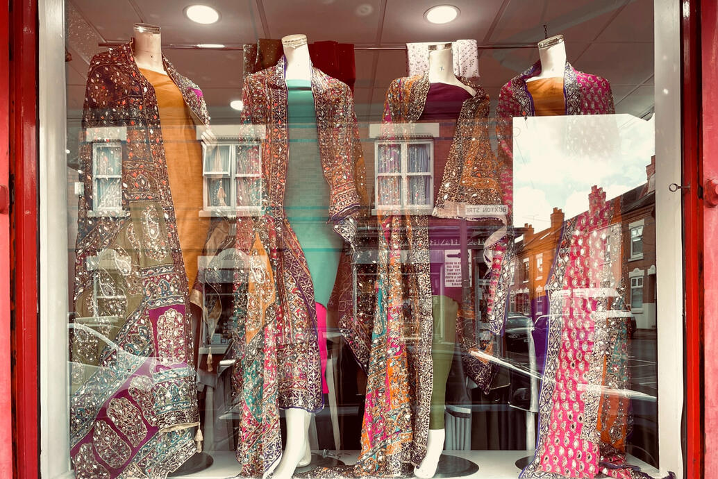 Grateful Sparkling fabric and garments in shop window
